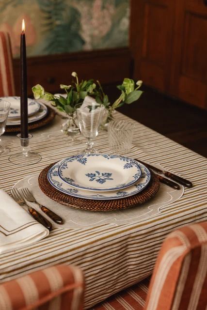 A relaxed dining table arranged with everyday tableware